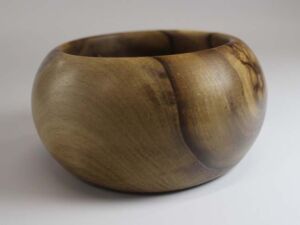 Part of Gratitude Series Woodturned, palm-sized gratitude bowl made from walnut; 4"x2.25" with Tung oil finish