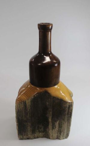 Part of Western Heritage Series Woodturned decorative "emerging bottle" made from historic cedar fencepost; 1.7"x 5"; finished with Minwax