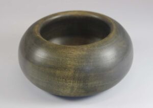 Part of Gratitude Series Woodturned, palm-sized gratitude bowl made from greenheart; 4.5"x2.5" with Tung oil finish