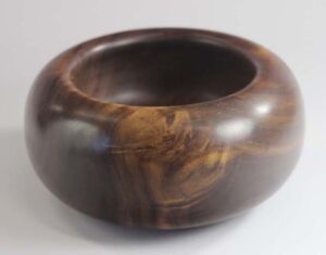 Part of Gratitude Series Woodturned, palm-sized gratitude bowl made from walnut; 5.25"x2.75" with Tung oil finish